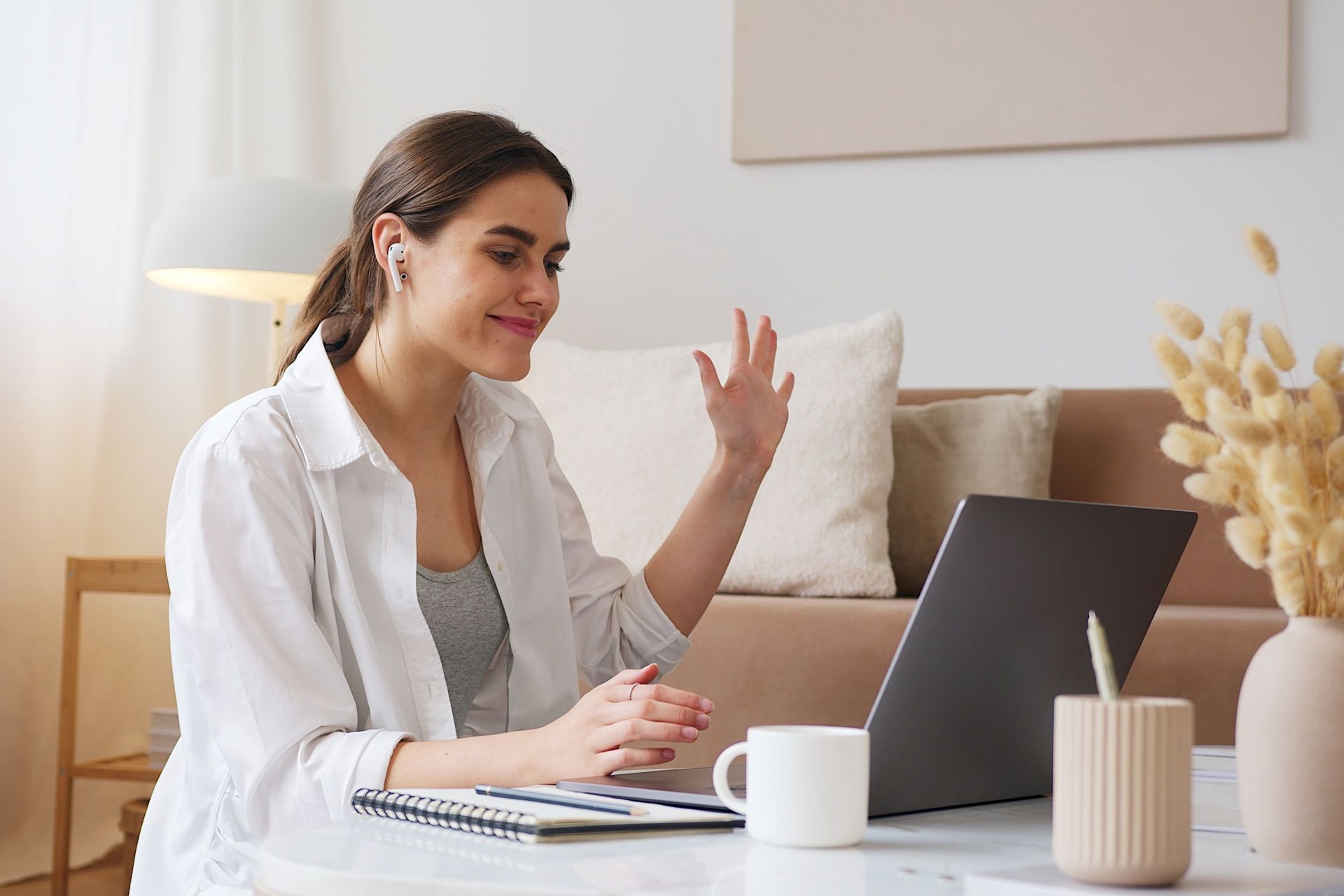 Remote worker wearing a wireless headset during a video call